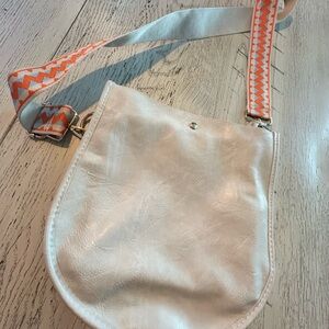 Elegant Cream Crossbody Bag with Orange Patterned Strap